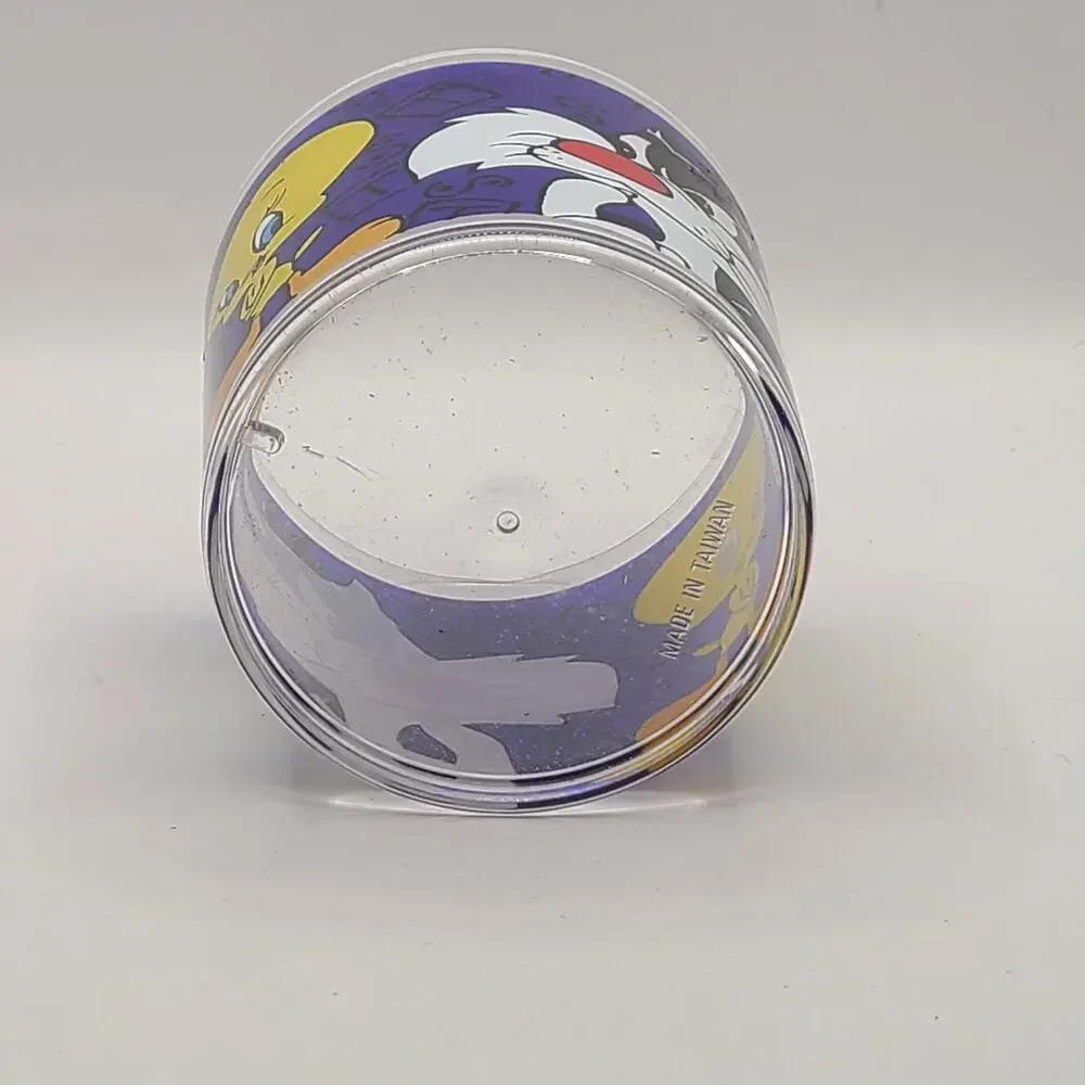 vintage 1994 Warner Brothers clear Plastic. mug featuring the Looney Tunes